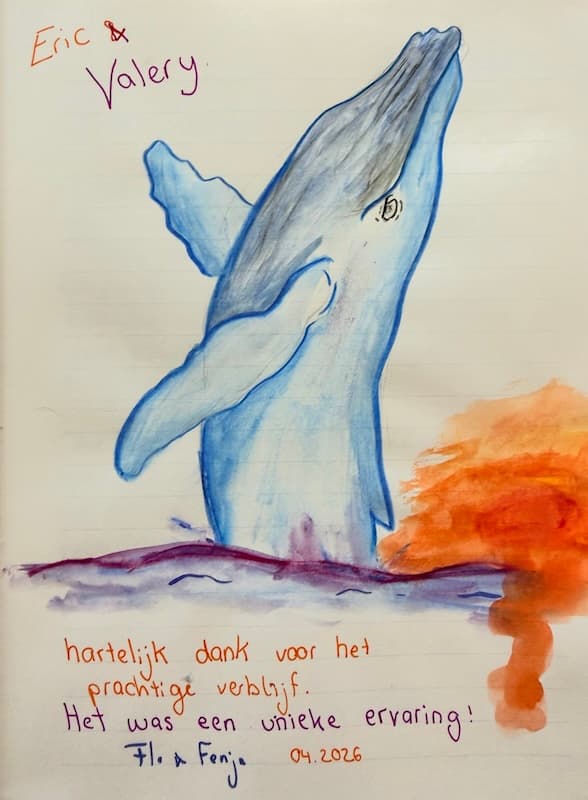 Colourful guestbook drawing of a dolphin with a Dutch message thanking Eric and Valery for a wonderful and unique stay.