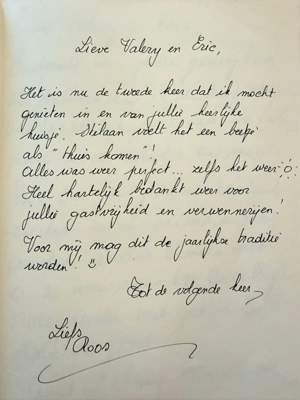 Handwritten Dutch guestbook note from a returning guest who describes the guesthouse as coming home and hopes to return every year.