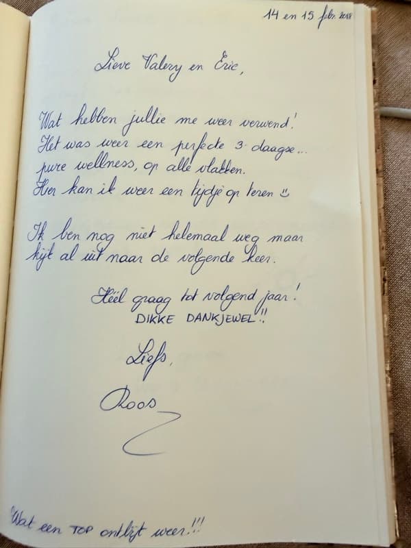 Handwritten Dutch guestbook note from a returning guest praising another perfect wellness stay and the breakfast.