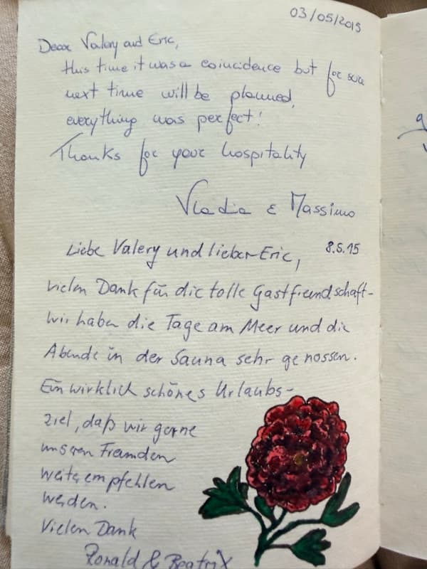 Two handwritten guestbook notes in English and German thanking the hosts for their hospitality, beach days and sauna evenings, beside a red flower drawing.