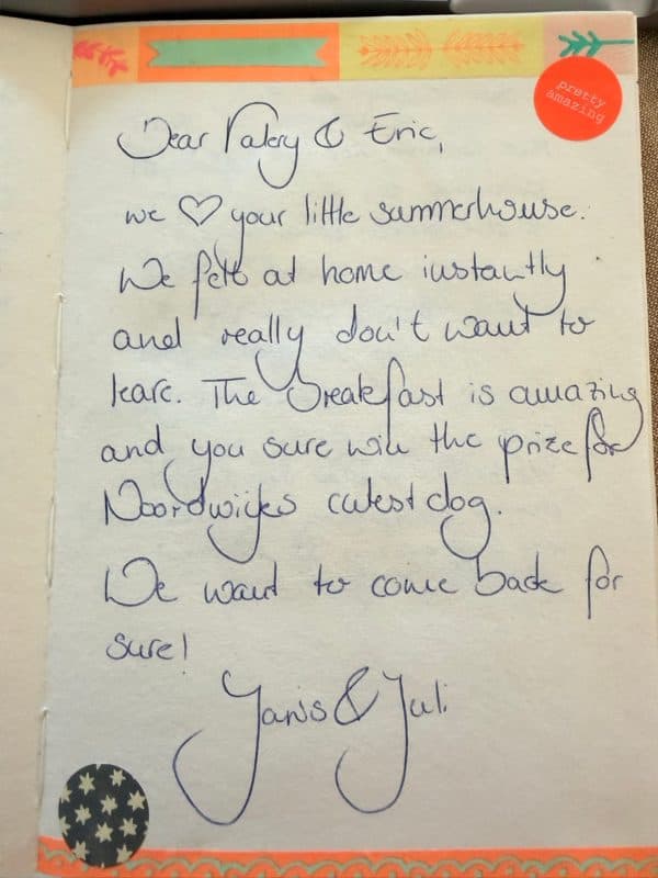 English guestbook note saying the guests felt at home and loved the breakfast and Max, framed by colourful decorative tape and stickers.